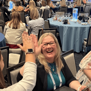 Event participants high fiving