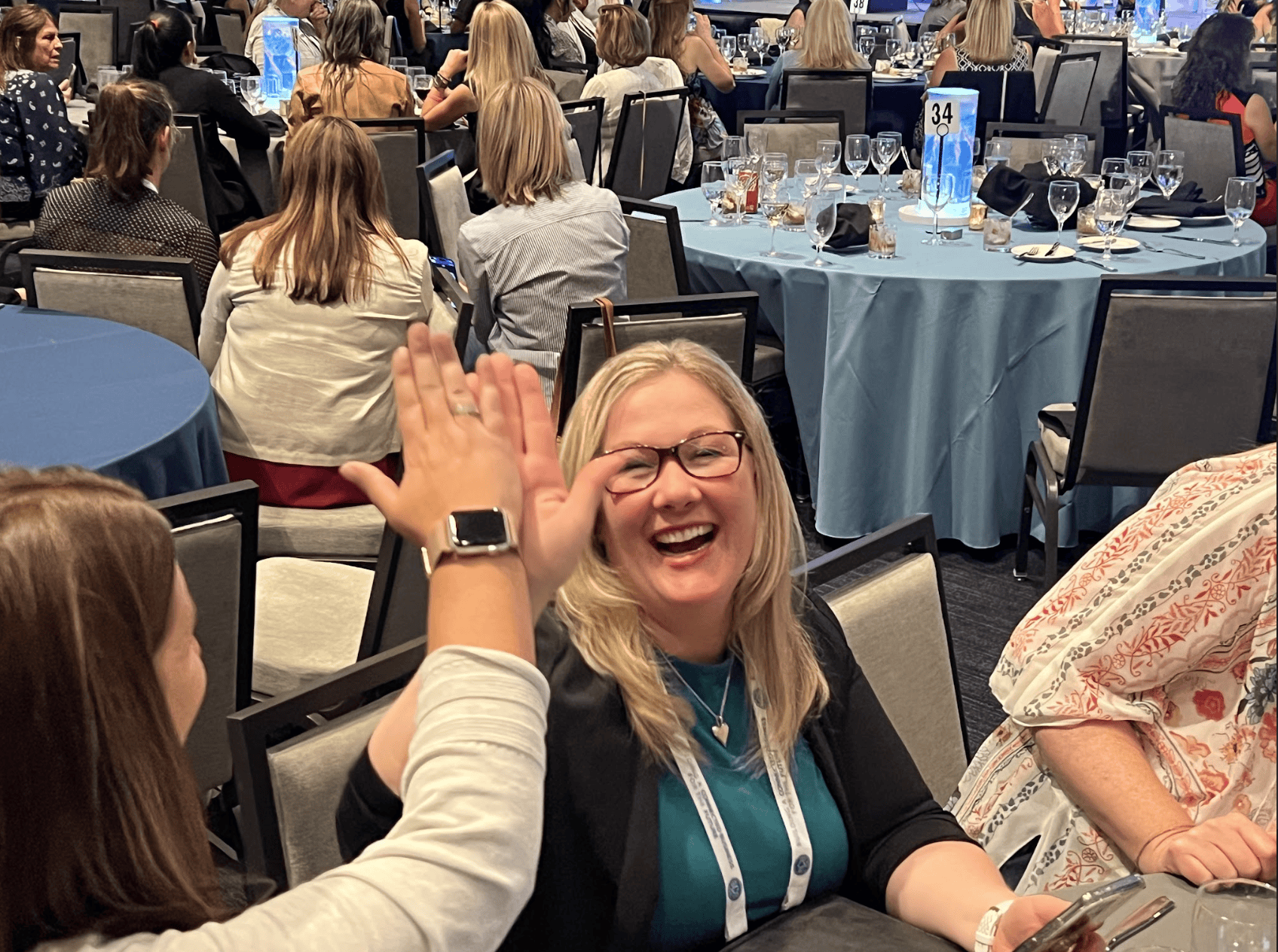 Event participants high fiving