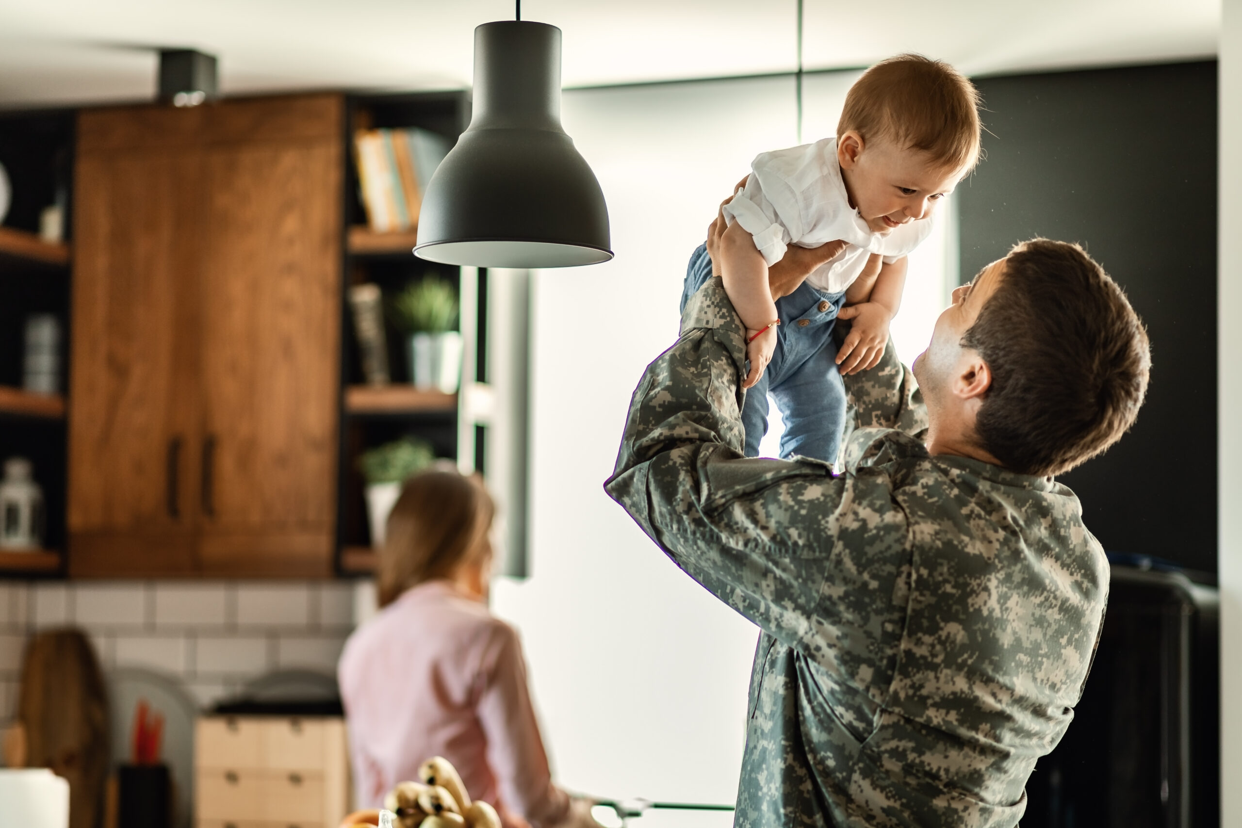 Military dad at home with family